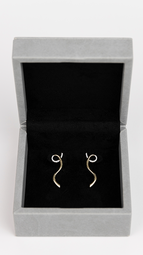 18K gold diamond, spiral earrings, jewelry,  displayed in jewelry box